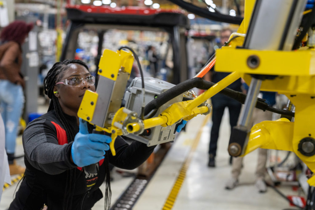 woman operating yellow piece of machinery | Rhino Innovation