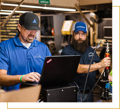employees conducting an on-site calibration