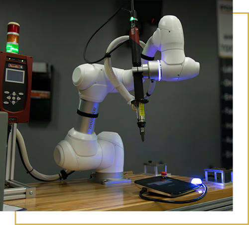 collaborative robot in the process of working on tool